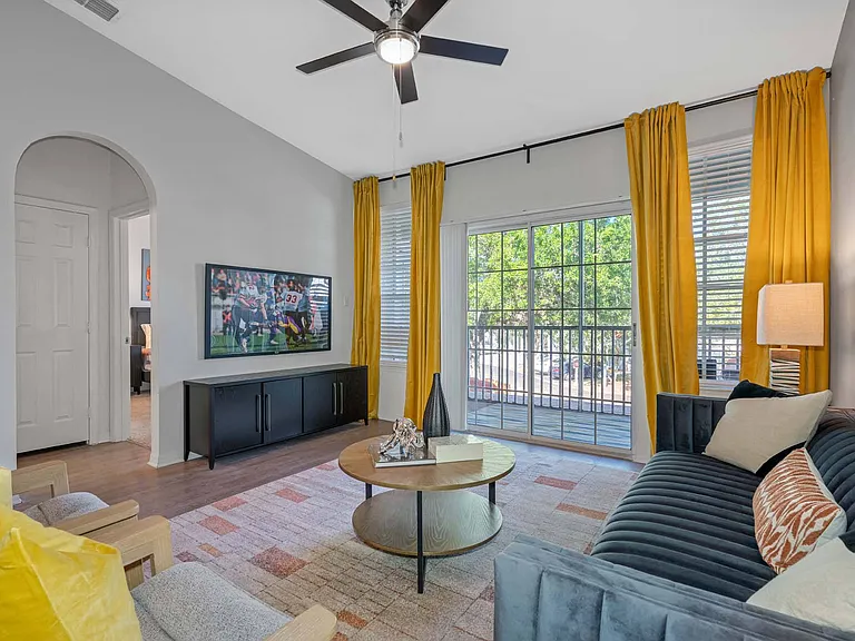 9' or vaulted ceilings and expansive windows, providing plenty of natural sunlight.