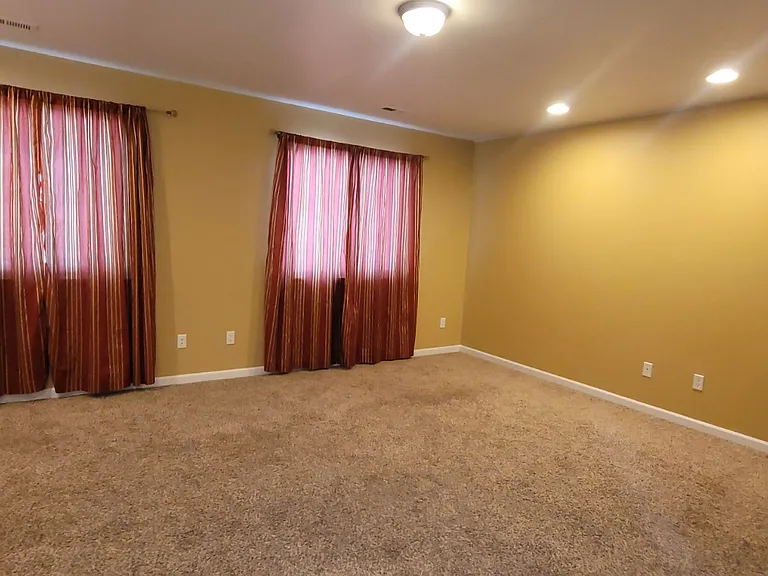 Master bedroom, curtains closed.