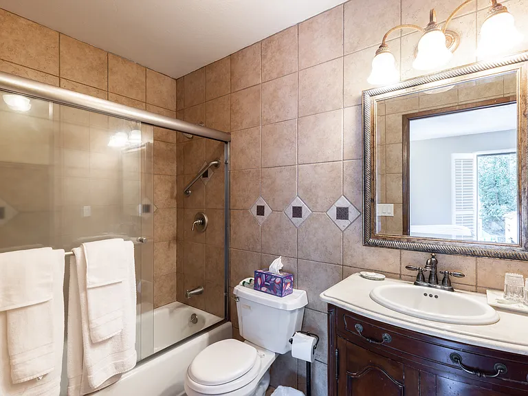 Unwind in style with this serene, well-appointed bathroom.