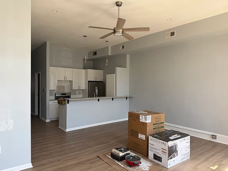 Newly renovated kitchen: High gloss cabinets and granite counterops, brand new dishwasher, stove and microwave.