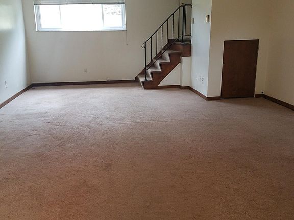 LIVING ROOM/DINING AREA. STORAGE UNDER STAIRS.