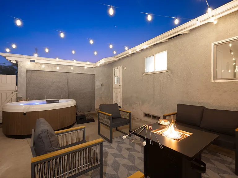 Soak your cares away in the hot tub under the stars.