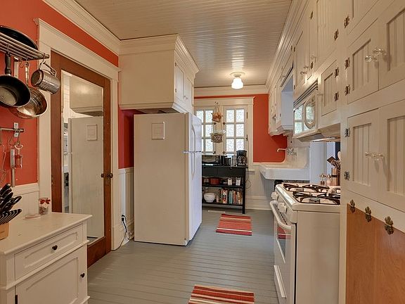 Kitchen is small and without dishwasher, but has good storag