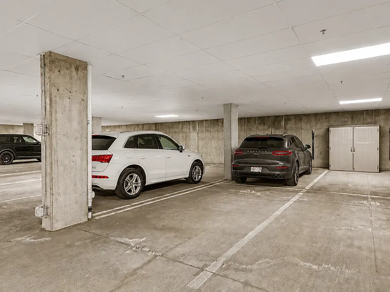 Deeded 2 parking spaces with EV charger in secure garage