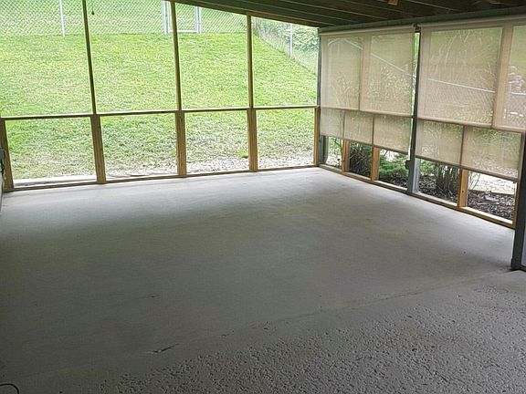 A great space to entertain and enjoy the lovely backyard view!