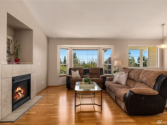 Living room with natural gas fireplace.