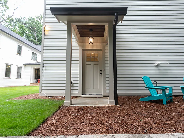 Dedicated separate entrance with doorbell and alarm system