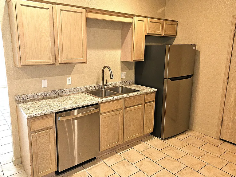 New stainless steel kitchen appliances and countertops