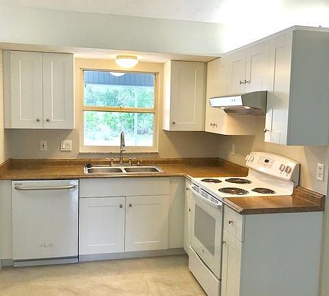 Kitchen has view of backyard and easy access to dining area. Perfect for entertaining. Modern Cabinets. New Refrigerator, Dishwasher.