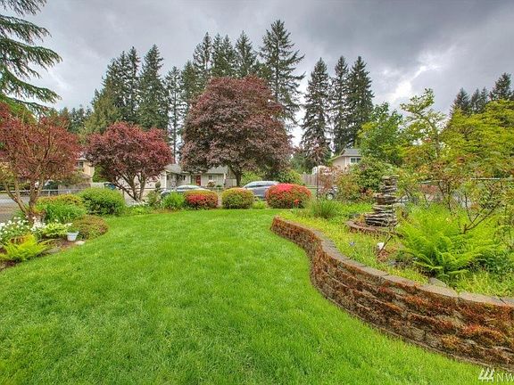 Park like mature front & back yards. Fountain in front yard to stay with home.