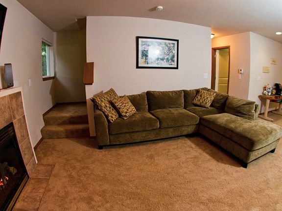 The living room is cozy with a gas fireplace