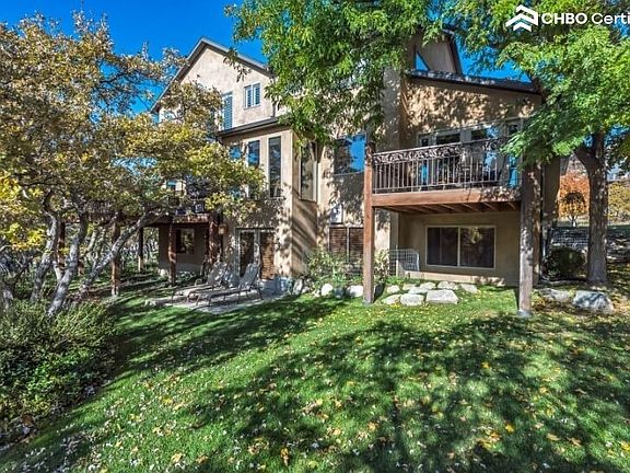 Private backyard w/ fountains, stone paths, patio and grass