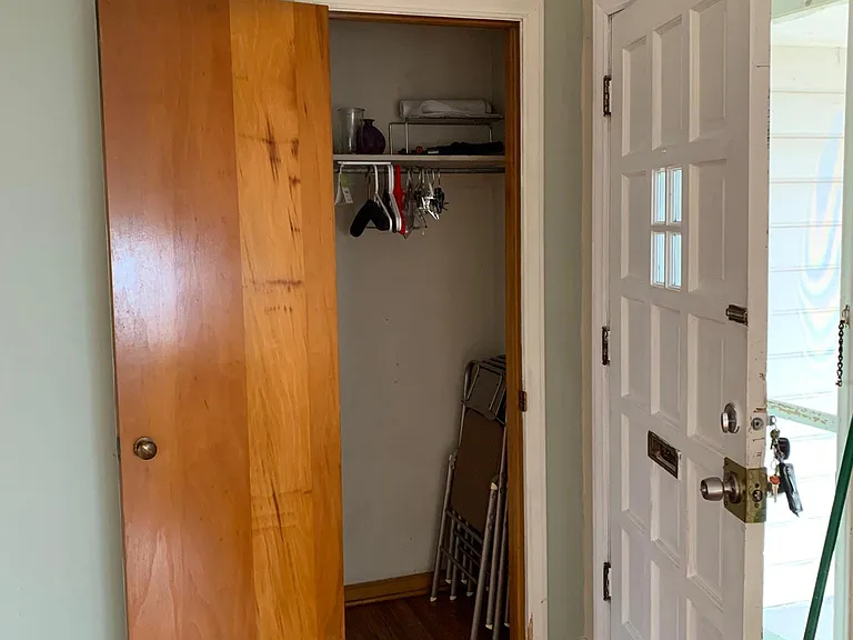Front door with coat closet right behind it
