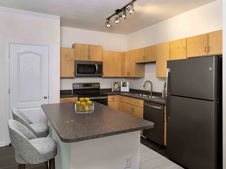 Spacious kitchen with slate appliances and large island
