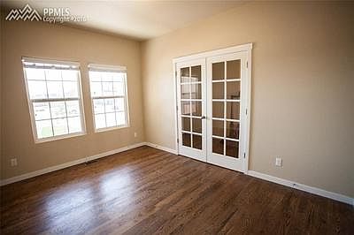 Beautiful office with hard wood floors.