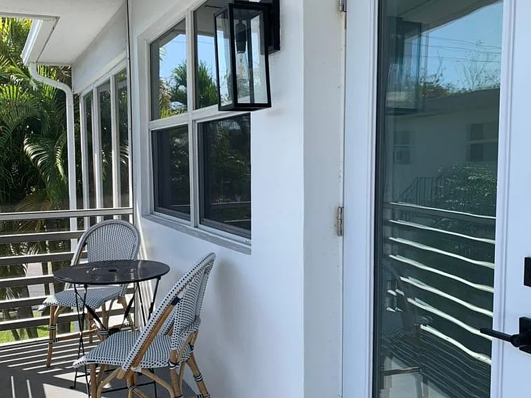 Front screened in porch and front door