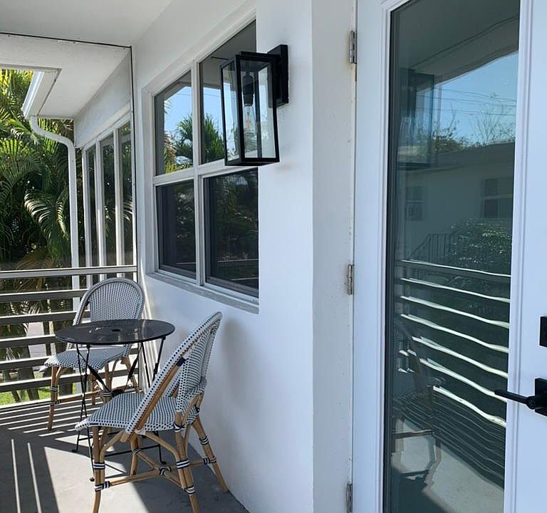 Front screened in porch and front door