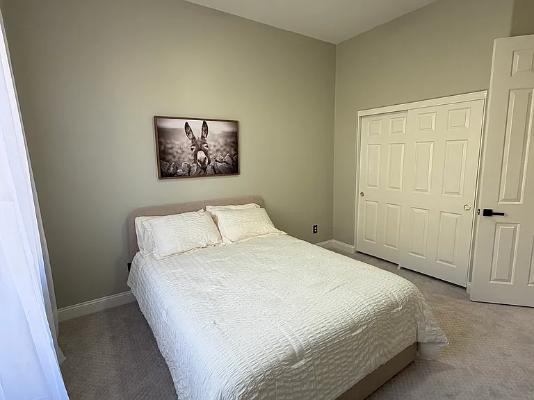 Bedroom with closet and ceiling fan