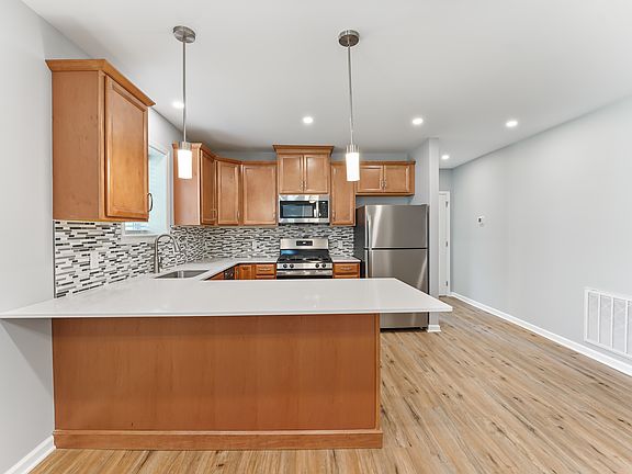 In addition to what you see...an ice maker, dishwasher, and garage disposal. And did we mention gas range and over!