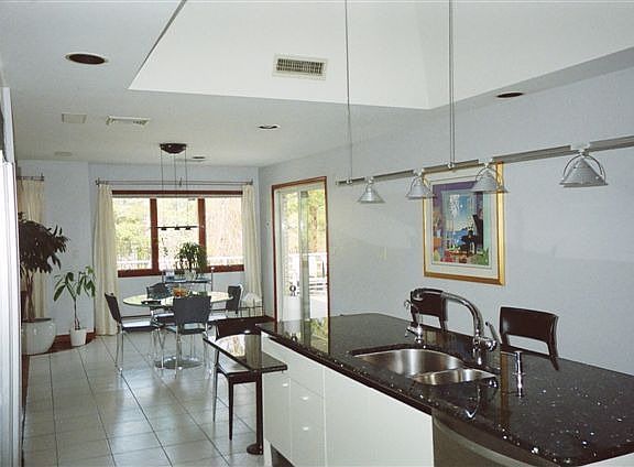 kitchen with granite island, skylight & separate breakfast area