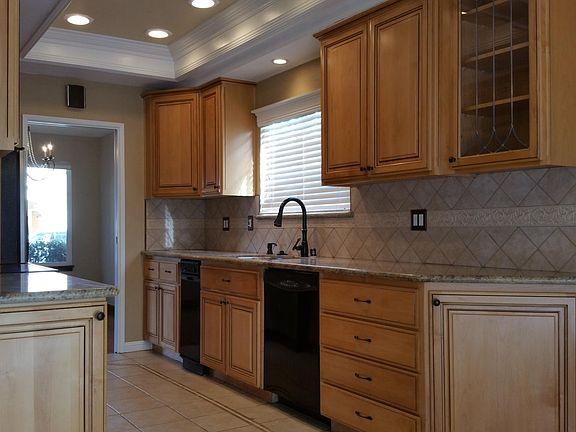 Granite countertops and tile backsplash