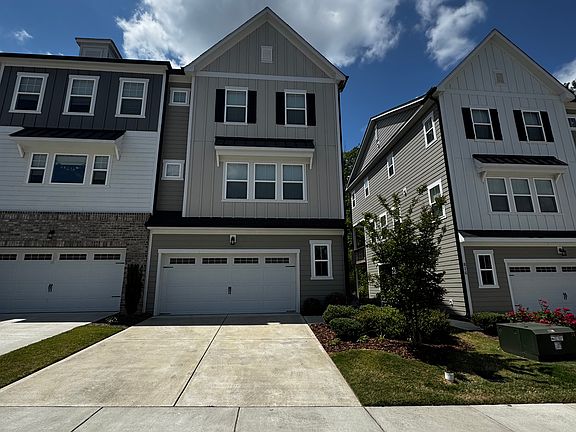 End-unit townhouse with 2-car garage and driveway parking