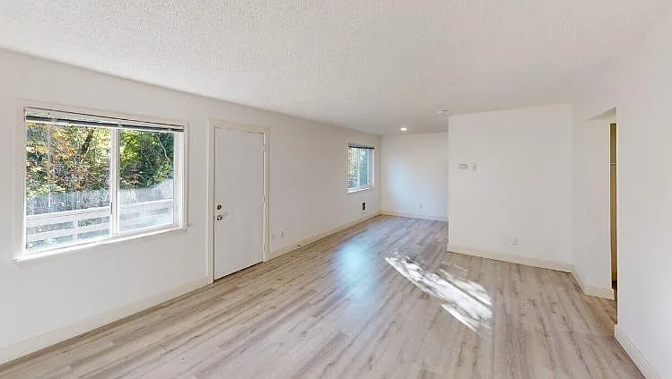 Durable vinyl plank flooring throughout for a sleek, modern look