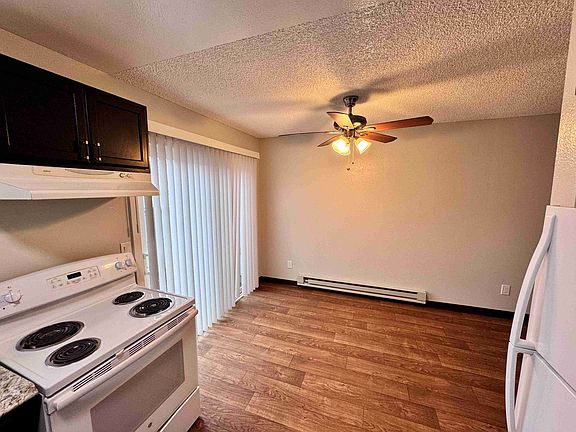Dining area next to kitchen with lots of natural light. Easy access to patio area.