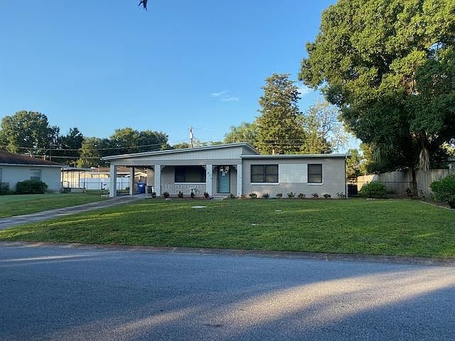 Welcome home to charming curb appeal! A spacious driveway, ample street parking, and a covered carport provide plenty of convenience, while the quaint front porch invites you to sit back and enjoy the neighborhood's charm.
