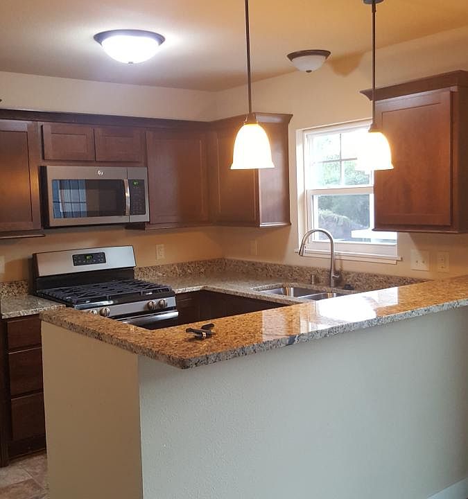 kitchen with granite, plus stove, microwave, dishwasher and 