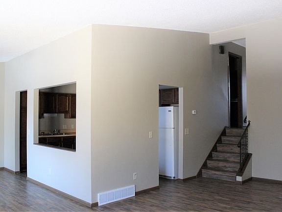 Main living area - new flooring! Entire unit has a new coat of paint. Ceilings are 8-12 feet high.