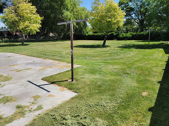 Backyard with clothes line and sprinkling system