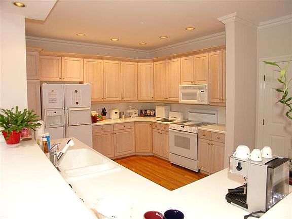 Open kitchen with loads of cabinets for easy entertaining.