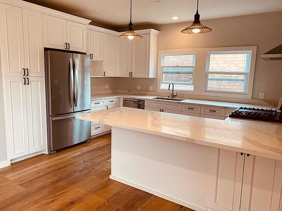 kitchen with dishwasher and full size appliances