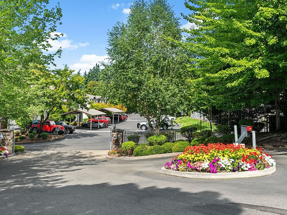 A welcoming entrance with beautiful landscaping, creating a warm arrival home.
