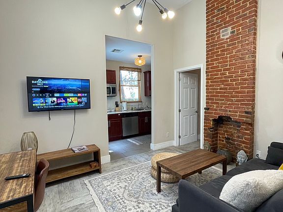 Living room opens to the kitchen and bedroom