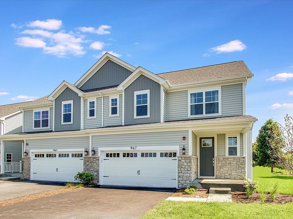 Townhome living with timeless curb appeal and a private two-car garage.