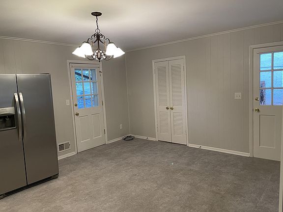 BREAKFAST ROOM: LEFT DOOR TO BACK YARD, RIGHT DOOR TO CARPORT, CENTER DOOR TO LARGE LAUNDRY ROOM