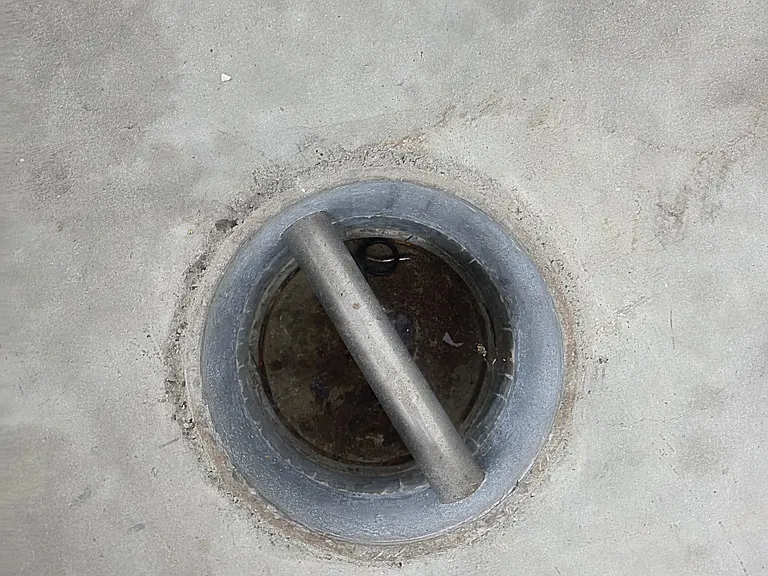 There are 12 tie Downs that are below the surface of the concrete permanently mounted for pulling frames