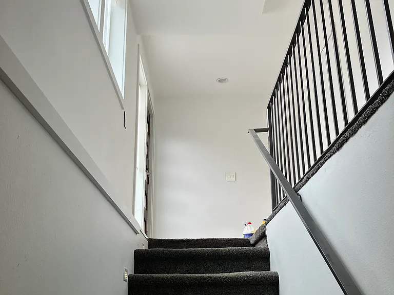 Stairs looking up to foyer/entrance.