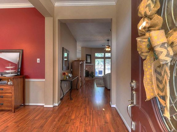 Wow! Stunning wood laminate floors as you walk in the home.
