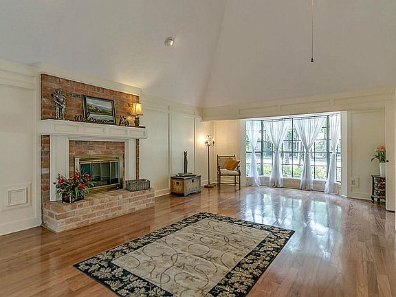 Gas log fireplace and Wet bar with a refrigerator