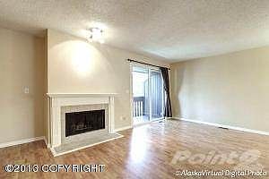 Living room with wood-burning FP . . .