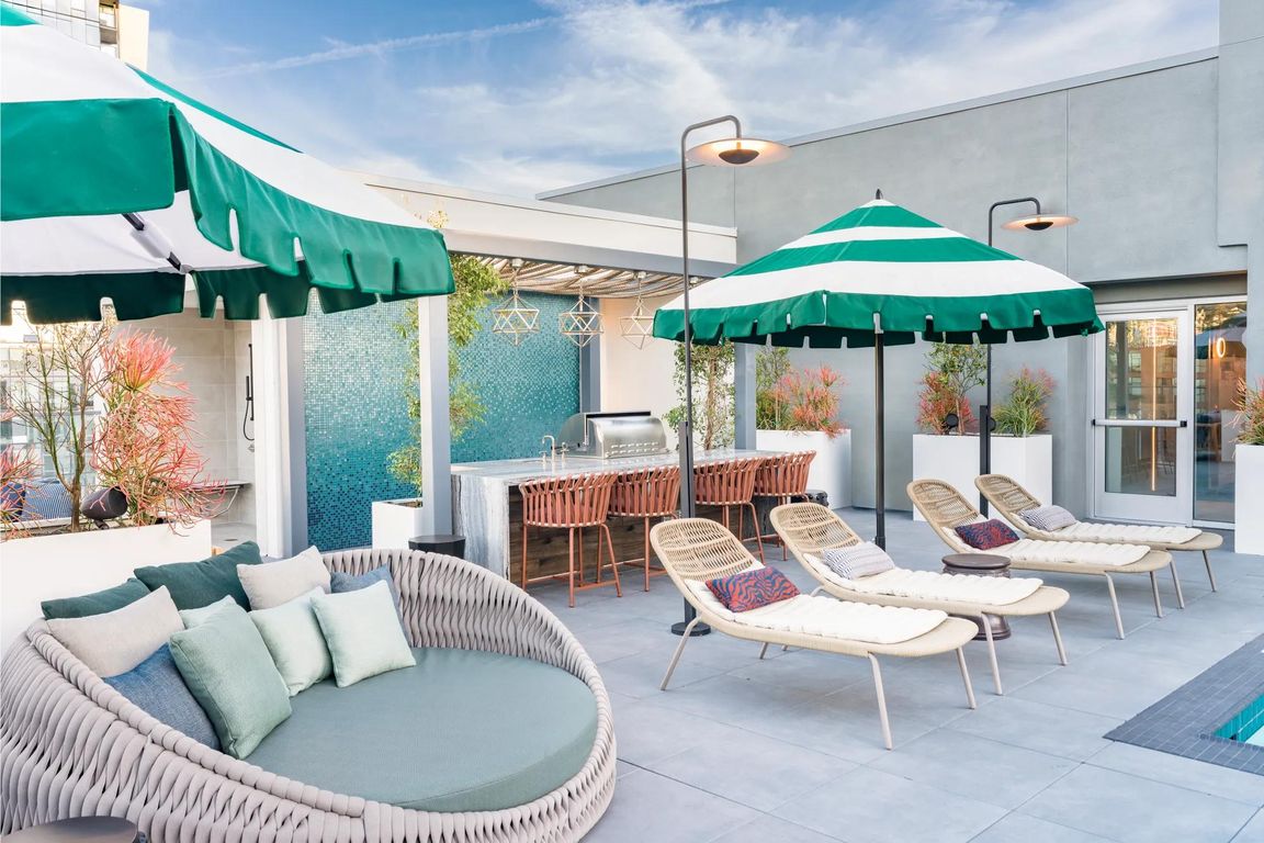 Relax by the pool on comfy daybeds and enjoy shaded areas for ultimate comfort.