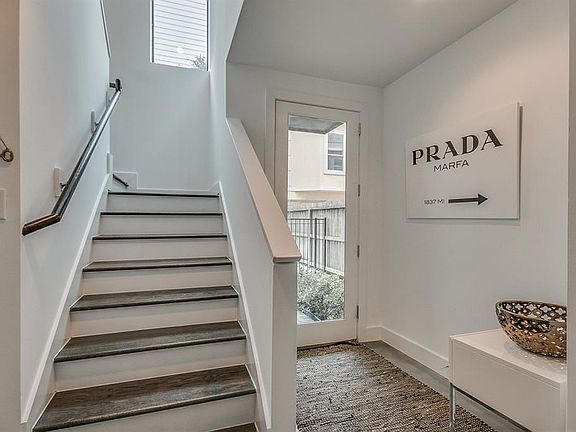 Another view of the entry with stairs leading to the second level.