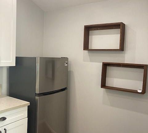 New refrigerator and floating shelves