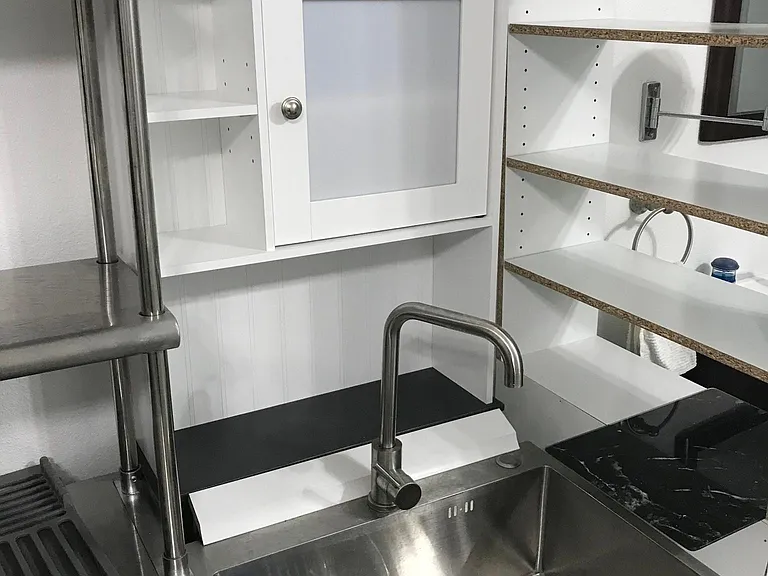 Mini-kitchen sink.