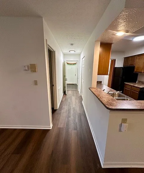 Entry hallway- the primary bedroom is on the left in the hallway