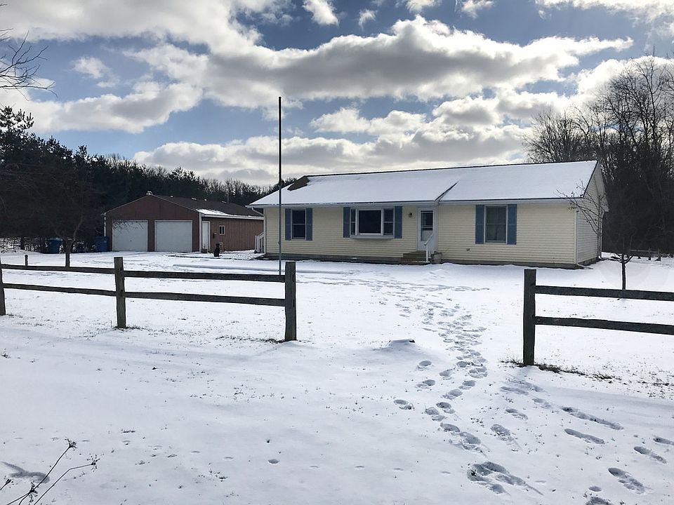 This home sits back off the road along a maple tree lined driveway. It sits on 2.73 acres with  apple trees, beautiful lawn, 30 x 40 garage with a heated shop,an additional out building and a chicken coop. The home is a 1450  square foot home with 3 bedrooms and 2 baths with numerous updates which include roof shingles, kitchen stainless steel appliances, Iron out water system and floor coverings.A great starter home or for a family downsizing.