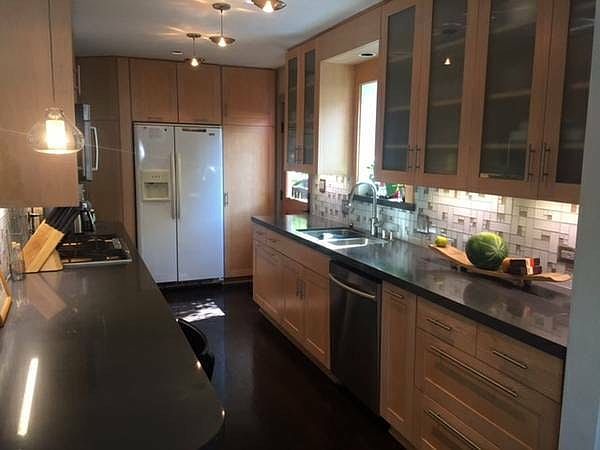 Kitchen with a door to deck